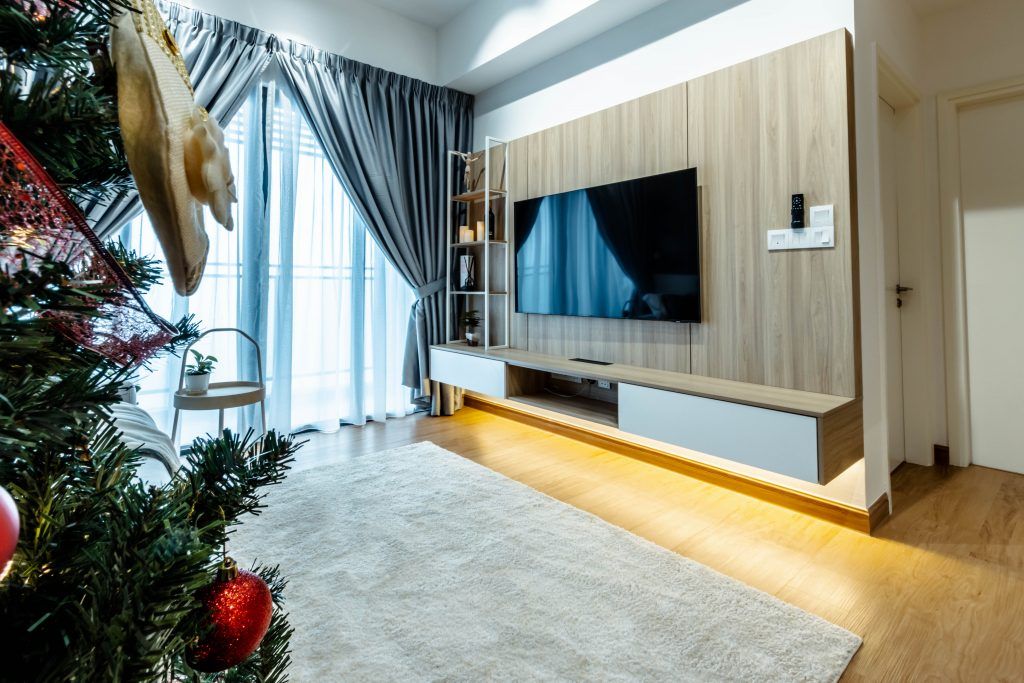 Custom-built TV console integrated with wall switches and lighting